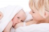 Mother breast feeding her baby girl Mother breast feeding her baby girl
